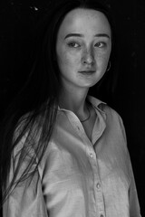 portrait of a young redhead young woman with freckles