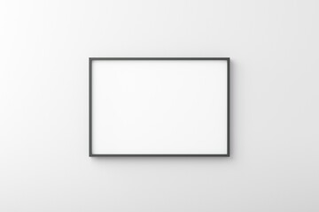 Thin black empty frame on white wall