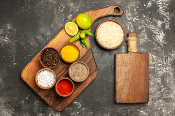 top view raw rice with lemons and seasonings on dark background raw food spice
