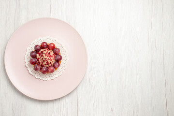 top view little cake with grapes inside plate on the white background fruit dessert cake