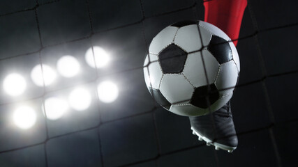 Kicking soccer ball into net, goal success concept.
