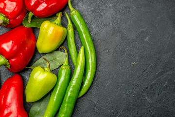 top view fresh bell-peppers on the dark background food salad ripe free space for text