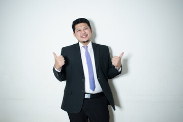 Young business man wearing a suit and tie
In a white background