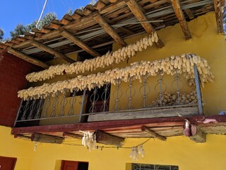 corn drying in sun on balcony in Peru