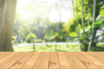 Empty wooden board table in front of blurred background. Perspective brown wood over wind nature background - can be used mockup for display or montage your products. copy space.