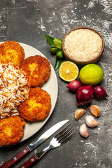 top view fried cutlets with cooked rice on a dark background meat food dish rissole
