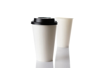 White paper cup for hot coffee with black lid isolated on white background. Takeaway blank small tea cup for your design text or banner of brand.