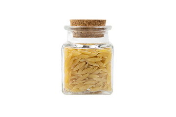 In Greece called kritharaki. In Italy called Orzo. Rice shaped pasta in a glass jar isolated on white background. Type of pasta. Food ingredient.