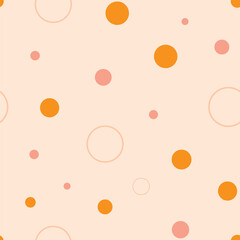 Fun dots and circles seamless repeat pattern. Hand-drawn dots and circles in different sizes and in eart tones, vector illustration.