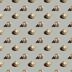 Seamless minimalistic seashell pattern on grey background. Photo collage. Pop Art. Postcard. Printing on fabric. Wrapping.