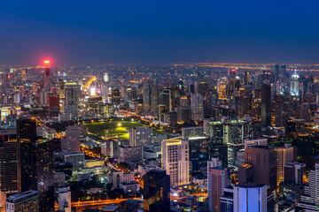 cityscape of Bangkok city skyline with night blue sky background, Bangkok city is modern metropolis of Thailand and favorite of tourists