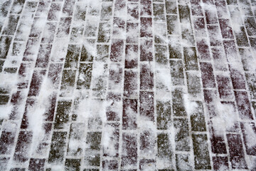 Snow-covered brick luggage in the winter garden