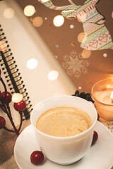 Festive evening with a cup of coffee and gifts, winter comfort and warm plaids, bokeh and space for text, copy space
