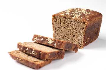 Rye bread with sesame seeds, slices on flour sourdough on a white background.