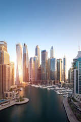 Fototapeta premium Cityscape and skyscraper at sunrise in Dubai Marina.