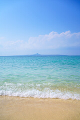 Fototapeta na wymiar White sandy tropical beach and clear water with blue sky in Okinawa Japan.