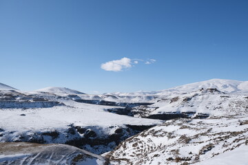 Border between Turkey and Armenia.  Snowy and beautiful mountains with blue sky.