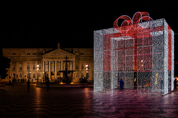 Praça do Rossio aka Praça Dom Pedro IV and Teatro Nacional D. Maria II during Christmas and holiday season at night. Lisbon, Portugal