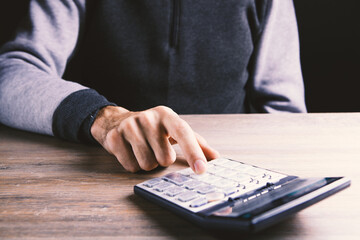 Close up calculator and financial report - accounting concept