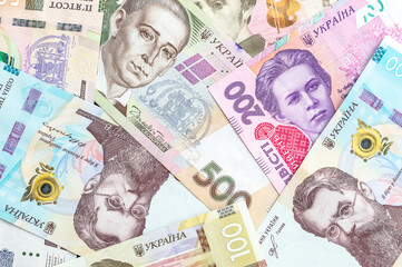 Different ukrainian hryvnia bills as financial background.