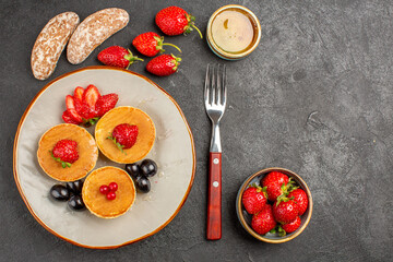 top view yummy pancakes with fruits on dark background pie cake fruit sweet