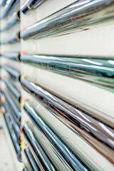 Display varies type of Car Window Tinting Vinyl Tinting Film roll on the wall.