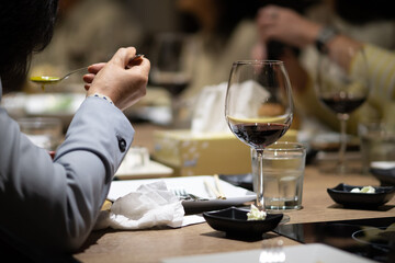 The wine glasses are placed on the table in the restaurant at the party