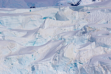 Snow-covered glacier surface. Glacier breaks close up. Global warming. Glacier melting.