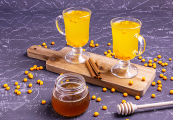 hot and healthy tea with sea buckthorn, honey and cinnamon.