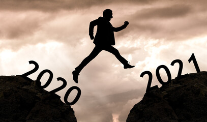 Man jumping from one year to the new one