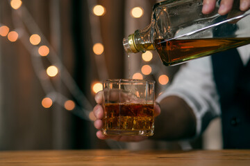 Close-up Barman pouring whiskey whiskey glass beautiful night