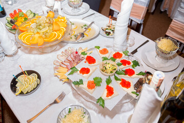 sandwiches with red caviar on the festive table