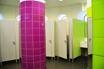 Colorful booths in a public toilet