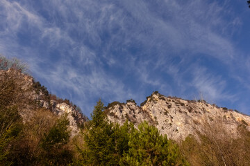 fine clouds with rocky mountains while hiking in the spring