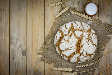 Delicious homemade rye bread on a wooden table. The view from the top