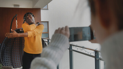 Live streaming or vlogging. African american black man working out, online class. High quality photo
