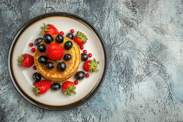 top view delicious pancakes with fruits and berries on dark desk cake fruit dessert