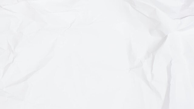 Stop motion animation paper wrinkles. Two color concept backdrop paper blank sheet making a paper ball folds and unfolds. 4k