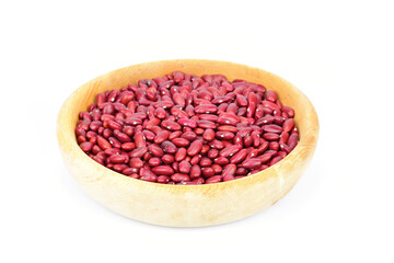 Wooden bowl with red raw beans isolated on white background