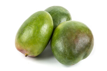 Three large ripe green mangoes from Brazil isolated on white