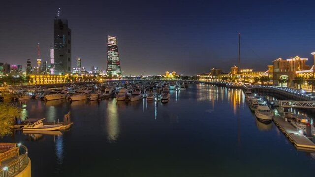 Yachts and boats at the Sharq Marina day to night transition timelapse hyperlapse in Kuwait. Kuwait City, Middle East. View from bridge