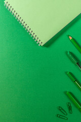 blank green notepad pen pencil