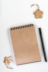 Brown notepad spiral wooden objects black pencil