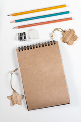 Brown notepad spiral wooden objects bright pencils stationery