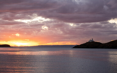 Greece, Kea Tzia island. Lighthouse on rocky cape, sky, sea background.