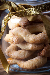 Jar of Christmas cookies with golden ribbon