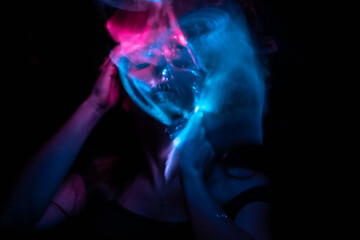 Obraz premium Girl, model photographed on a long exposure in the studio with color filters. Portrait