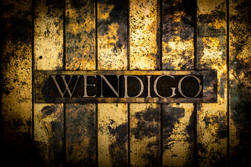 Wendigo text on grunge textured copper and gold background
