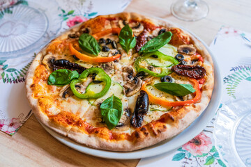 vegetable pizza on wooden table