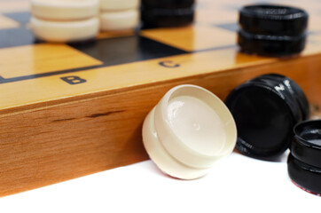 Board and checkers for the game. Entertainment and home leisure